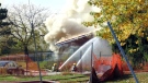 Firefighters work to extinguish a fire at Fairview Lodge in Whitby, Ont., Monday, Oct. 27, 2014. (Jim Miller / MyNews)