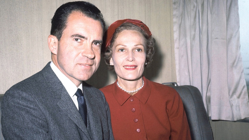 In this June 5, 1960 file photo, former President Richard Nixon, left, and his wife Pat pose for photos while campaigning at Rockefeller Center in New York. (AP File Photo)
