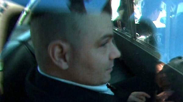 Michael Rafferty is shown in a police cruiser after a day at his first-degree murder trial in London, Ont., Wednesday, March 14, 2012.