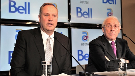 BCE President and CEO George Cope, left, and Astral Media President and CEO Ian Greenberg speak during a press conference ni Montreal on Friday, March 16, 2012. (Paul Chiasson / THE CANADIAN PRESS)     