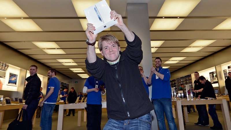 Lukas from Germany is the first to get the new iPad at the Apple store in a shopping mall in Oberhausen, western Germany, Friday, March 16, 2012. (AP / Martin Meissner)