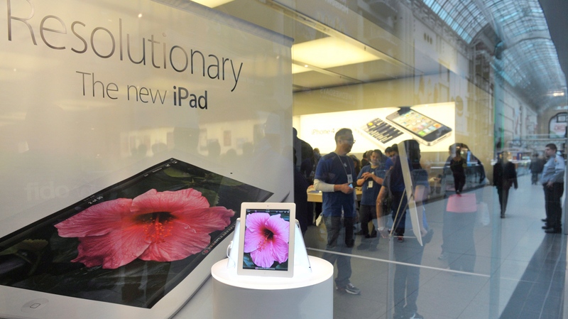 The 'new iPad' is shown as people pack the Apple Store in Toronto on Friday, March 16, 2012. (Nathan Denette / THE CANADIAN PRESS)
