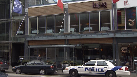 Police investigate after two men were shot outside the Italian Kitchen restaurant on Friday night. Mar. 17, 2012. (CTV)