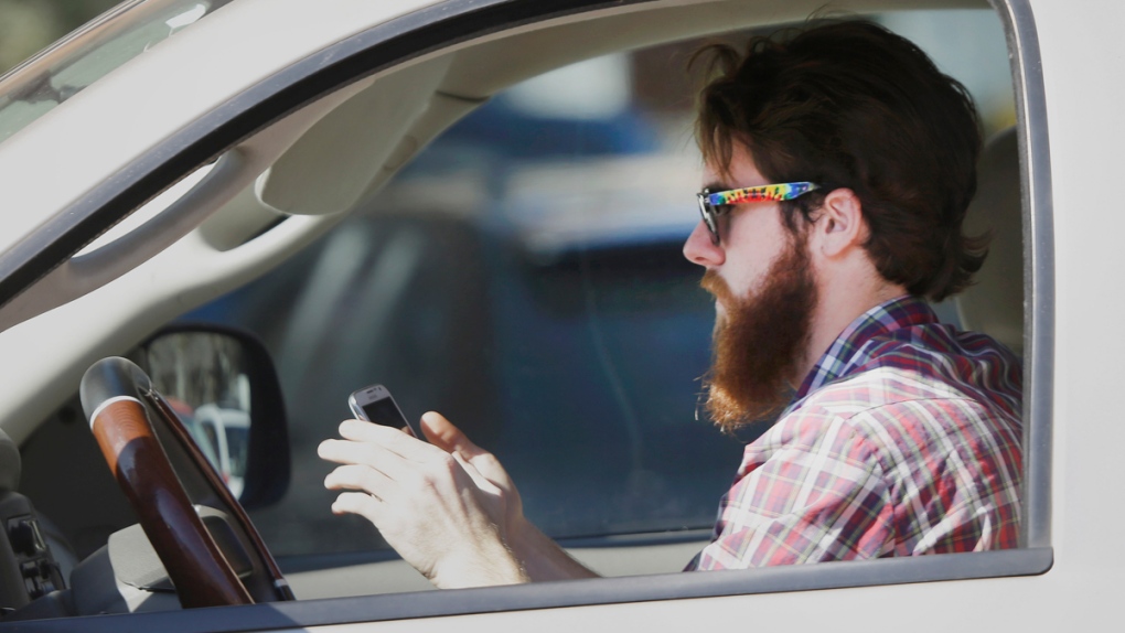 A driver using his cell phone