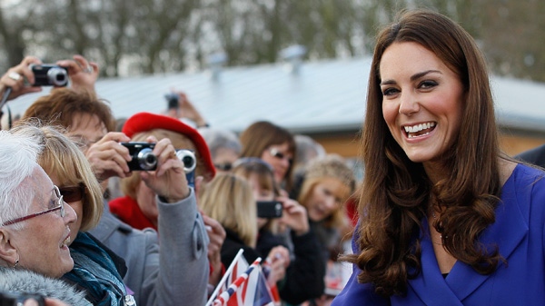 Britain's Duchess of Cambridge smiles as she meets members of the public during a visit to The Treehouse in Ipswich, England, Monday, March 19, 2012. (AP / Kirsty Wigglesworth, pool)