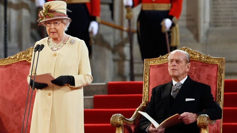 Queen Elizabeth II makes an address next to her husband The Duke of Edinburgh at Westminster Hall in London, Tuesday, March 20, 2012.(AP / Kirsty Wigglesworth)