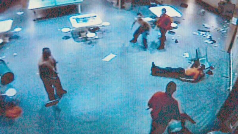 A screenshot from Saskatoon Correctional Centre security footage shows a brawl between two groups of inmates.