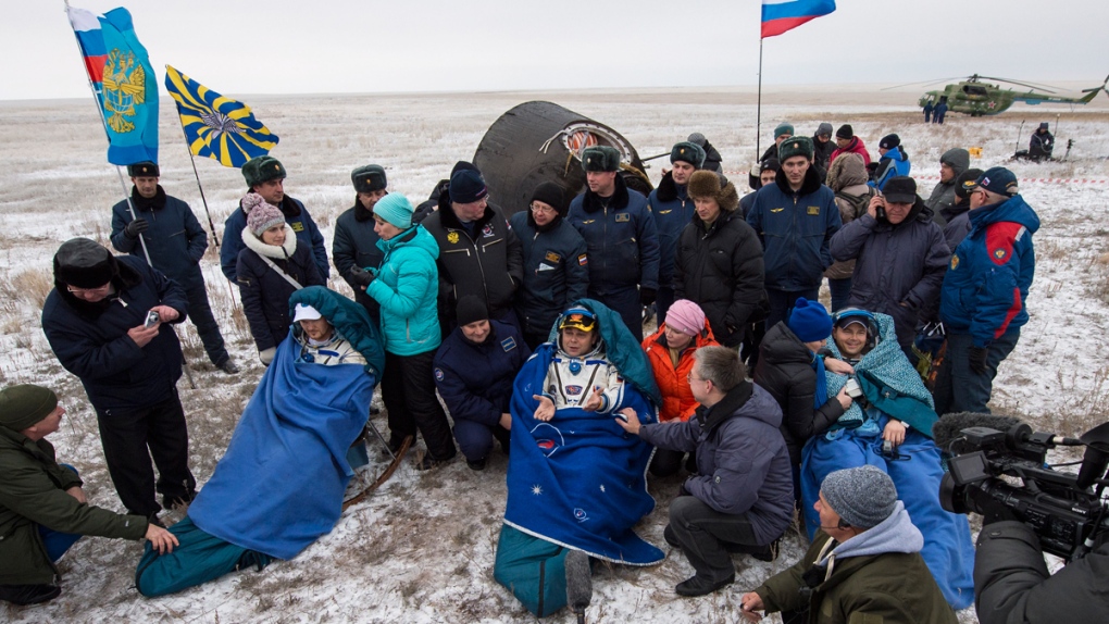 Expedition 41 crew outside the Soyuz TMA-13M