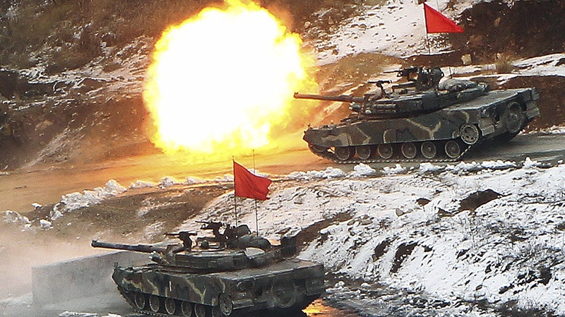In this March 8, 2012 file photo, a South Korean army K1 tank fires during an annual South Korea-U.S. joint military drill, known as the Key Resolve exercise, at Seungjin Fire Training Field in Pocheon, south of the demilitarized zone (DMZ) that separates the two Koreas since the Korean War. (AP Photo/Yonhap, Lim Byung-shick)
