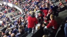 A Toronto Maple Leafs fan pours a drink on an Ottawa Senators fan during an argument at a game between the two teams on Sunday, Nov. 9, 2014. 