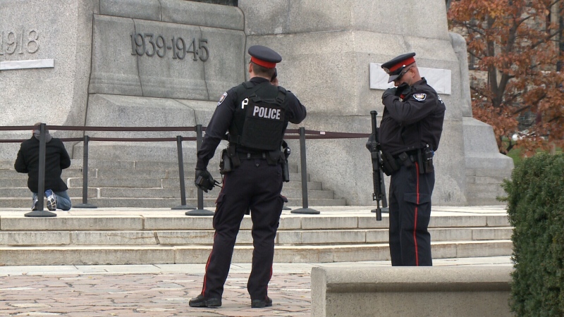 Heavily armed Ottawa Police officers stand guard at Ottawa's National War Memorial in preparation for Remembrance Day ceremony. (Jeff Dorn/CTV Ottawa)
