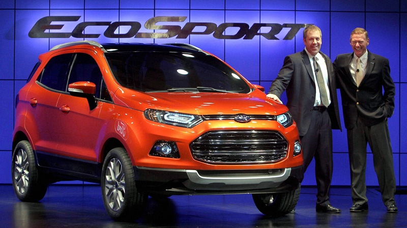 President and Chief Executive Officer of Ford Motor Company Alan Mulally, right, and Group Vice President and President of Asia Pacific & Africa Joe Hinrichs pose with the newly launched Ford Ecosport in New Delhi, India, Wednesday, Jan. 4, 2012. EcoSport is the first Ford global model designed and developed entirely by its South American team. (AP Photo)