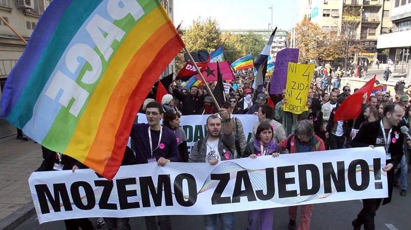 Members of the Serbian gay community march down a street in Belgrade, Serbia. (AP / Darko Vojinovic)