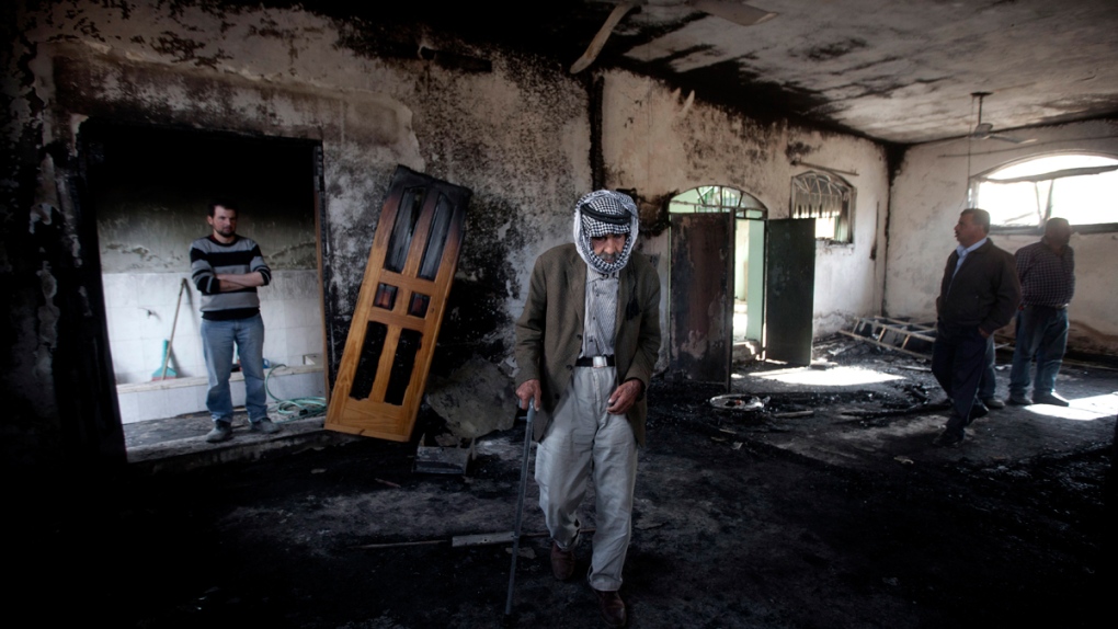 Fire-damaged mosque in Mughayer, West Bank