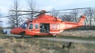 An Ornge air ambulance helicopter is shown after making an emergency landing in Colonel Samuel Smith Park near Humber College, Friday, March 23, 2012.