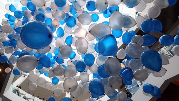 Hundreds of balloons are released at the University of Memphis on Wednesday, Jan. 18, 2012 in Memphis, Tenn. (AP Photo, The Commercial Appeal, Mike Maplel)