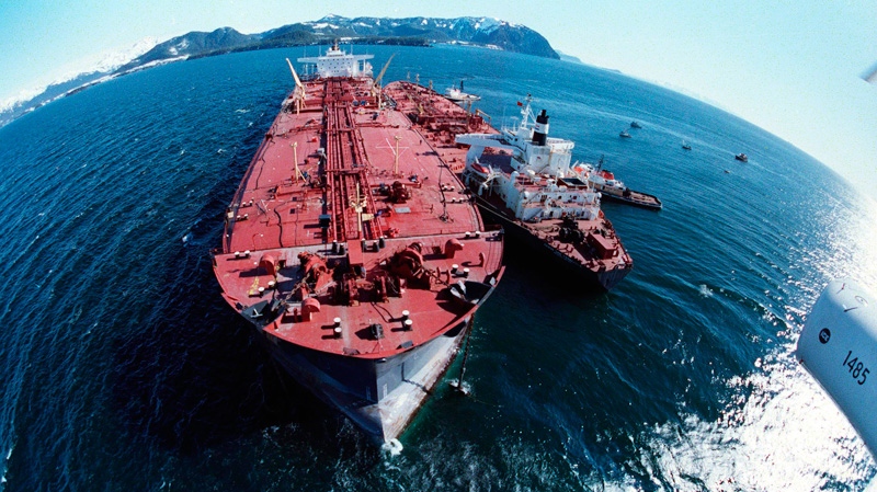 The grounded tanker Exxon Valdez, left, unloads oil onto a smaller tanker, San Francisco, as efforts to refloat the ship continue on Prince William Sound, 25 miles from Valdez, Alaska, on April 4, 1989. (AP Photo)