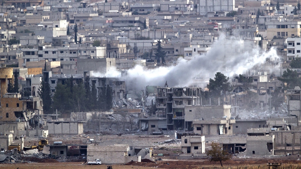 Smoke rises from blast in Kobani, Syria