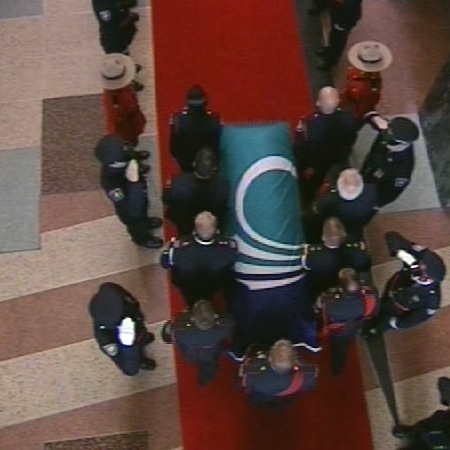 Pallbearers carry the coffin of former mayor Marion Dewar into Ottawa City Hall for a lying in state, Thursday, Sept. 18, 2008.