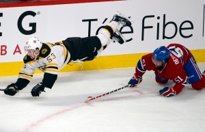 Bruins centre Seth Griffith upended by Desharnais