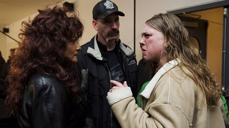 Terri-Jean Bedford, left, is confronted in Toronto on Monday March 26, 2012 by an advocate for a group called Sex Trade 101, Christine Barkhouse, right, who disapproves the decision of the Ontario's Court of Appeal after they struck downa ban on brothels.(Aaron Vincent Elkaim / THE CANADIAN PRESS)