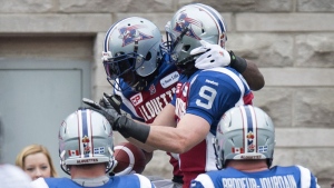 Montreal Alouettes slotback S.J. Green, left, celebrates his touchdown against the BC Lions with teammate Eric Deslauriers during second quarter CFL Eastern Semifinal football action Sunday, November 16, 2014 in Montreal. THE CANADIAN PRESS/Paul Chiasson