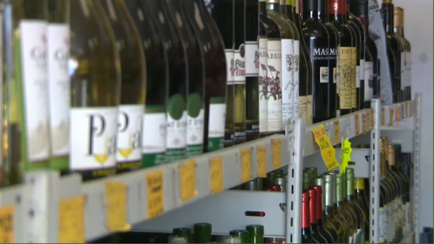 Wine bottles are on display at a liquor store.
