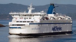 BC Ferries vessel Spirit of Vancouver Island passes between Galiano Island and Mayne Island while travelling from Swartz Bay to Tsawwassen, B.C., on Friday August 26, 2011. (Darryl Dyck/The Canadian Press)