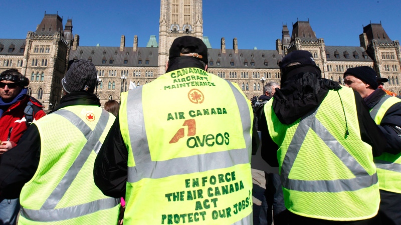 Locked-out Aveos maintenance workers, who maintained Air Canada aircraft, protest on Parliament Hill in Ottawa, Tuesday, March 27, 2012. (Fred Chartrand / THE CANADIAN PRESS)