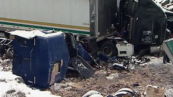 A Brinks tractor-trailer is shown after crashing an spilling millions of coins on Highway 11 north of Kirkland Lake, Ont. on Wednesday, March 28, 2012