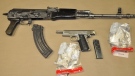 Seized firearms, ammunition and drugs and are seen in this image released by the London Police Service on Thursday, Nov. 20, 2014.