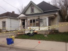 Police tape surrounds a home on Adelaide St. N. where two men were stabbed in London, Ont. on Sunday, Nov. 9, 2014. (Cristina Howorun / CTV London)