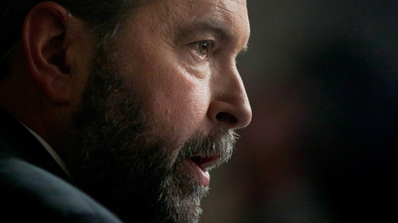 NDP leader Thomas Mulcair comments on the federal budget in the Foyer of the House of Commons on Parliament Hill in Ottawa Thursday March 29, 2012. (Adrian Wyld / THE CANADIAN PRESS)