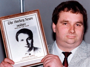 Graham James holds his award in Toronto on June 8, 1989, after being named The Hockey News man of the year. (THE CANADIAN PRESS/Bill Becker)