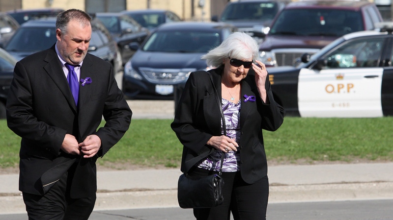 Rob Stafford, uncle, and Doreen Graichen, grandmother of slain Victoria Stafford, walk to court with for the Michael Rafferty murder trial in London, Ont., Friday, March, 30, 2012. (Dave Chidley / THE CANADIAN PRESS)