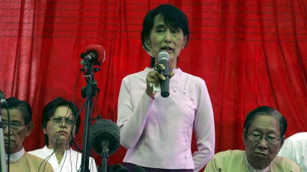 Myanmar opposition leader Aung San Suu Kyi talks to reporters during a press conference at her lakeside residence in Yangon, Myanmar Friday, March 30, 2012. (AP / Khin Maung Win)