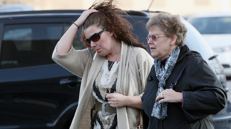 Tara McDonald, mother of slain Victoria Stafford, walks into court with her mother Linda Winters for the Michael Rafferty murder trial in London, Ont., Friday, March, 30, 2012. (Dave Chidley / THE CANADIAN PRESS)