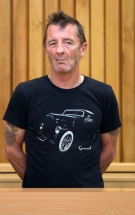 Phil Rudd, drummer for the rock band AC/DC, stands in the dock in the High Court at Tauranga, New Zealand, Wednesday, Nov. 26, 2014. (AP Photo/New Zealand Herald, Alan Gibson) 