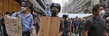Masked protesters demonstrate in Hong Kong
