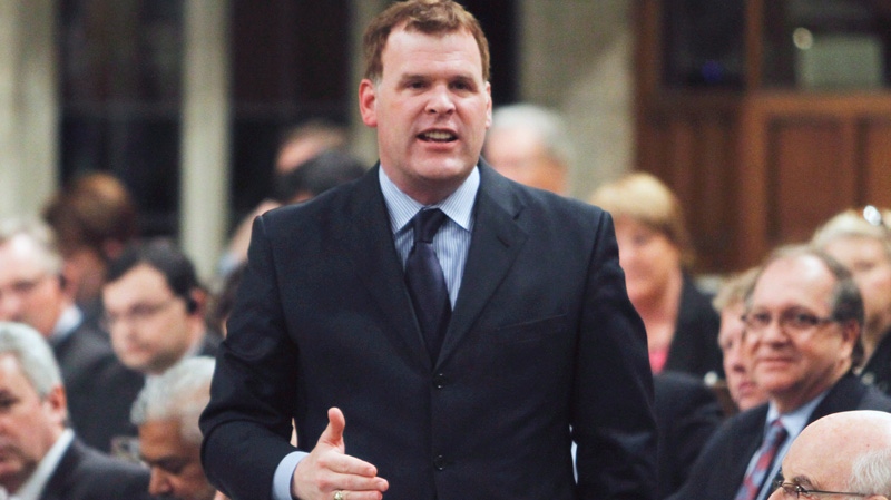 Foreign Affairs Minister John Baird stands in the House of Commons during question period in Ottawa on Friday, March 30, 2012.