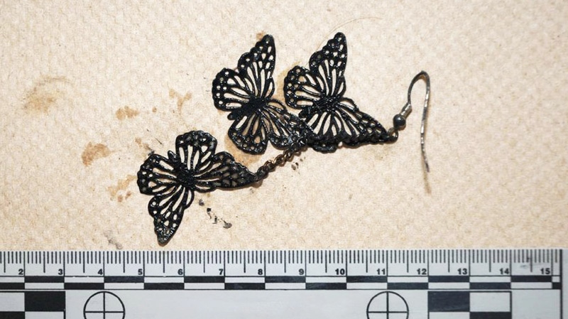 A butterfly earring worn by Victoria Stafford is shown in this evidence photo at the trial of Michael Rafferty on Tuesday, April 3, 2012. 