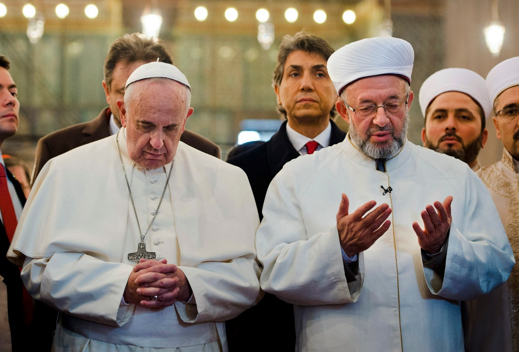 Pope Francis prays at Turkish mosque