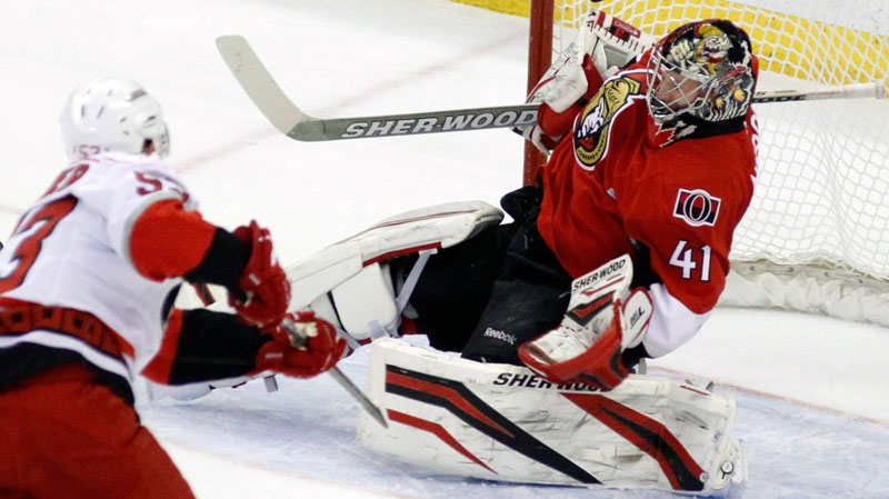 Ottawa Senators goaltender Craig Anderson (41) makes a save on Carolina Hurricanes' Jeff Skinner during first period NHL hockey action in Ottawa, Tuesday April 3, 2012.THE CANADIAN PRESS/Fred Chartrand