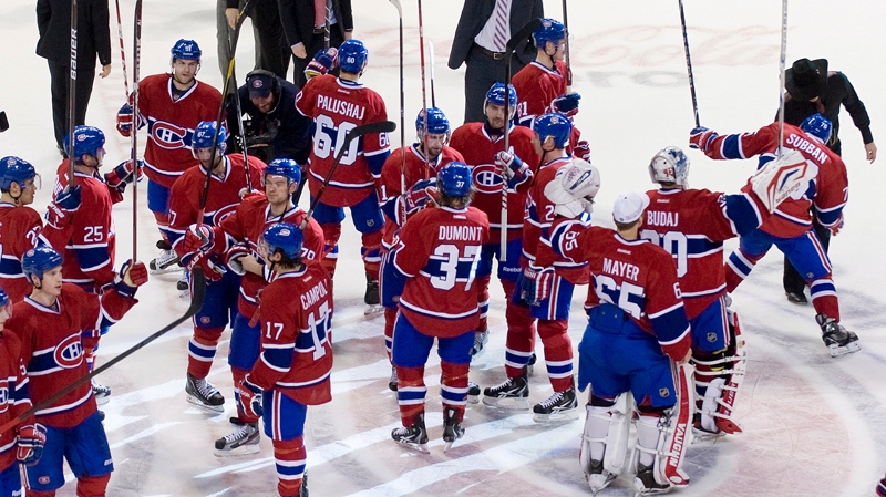 Montreal Canadiens players salute the crowd following their end of season NHL hockey game against the Toronto Maple Leafs in Montreal, Saturday, April 7, 2012. THE CANADIAN PRESS/Graham Hughes