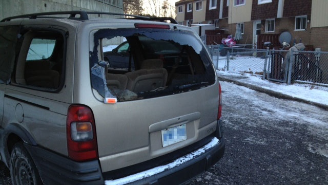 A vehicle is seen near the crime scene with its windows shot out.  The shooting happened about 10:00 p.m. on Penny Drive on Thursday, Dec. 4, 2014. (Jim O'Grady/CTV Ottawa)