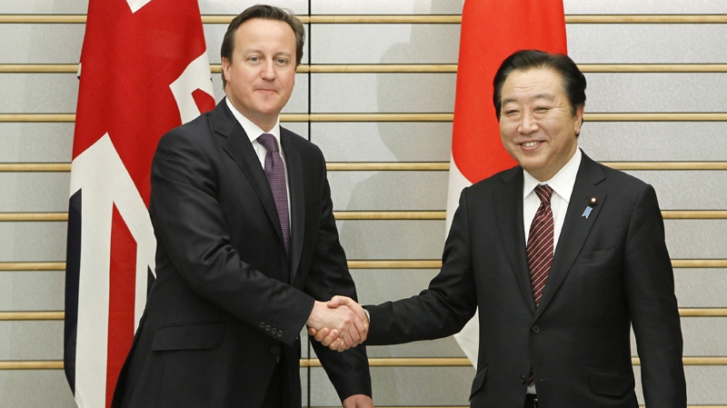 Britain's Prime Minister David Cameron, left, shakes hands with Japan's Prime Minister Yoshihiko Noda at the latter's official residence in Tokyo Tuesday, April 10, 2012. (AP Photo/Toru Hanai, Pool)