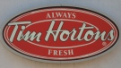 A Tim Hortons logo is shown at an outlet in Oakville, Ont., on Aug.25, 2010. (THE CANADIAN PRESS / Richard Buchan)