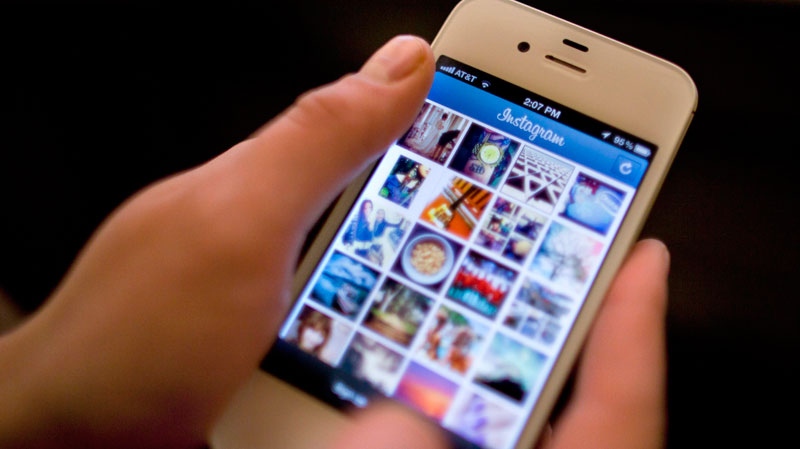 Instagram is demonstrated on an iPhone , in New York, Monday, April 9, 2012. (AP / Karly Domb Sadof)