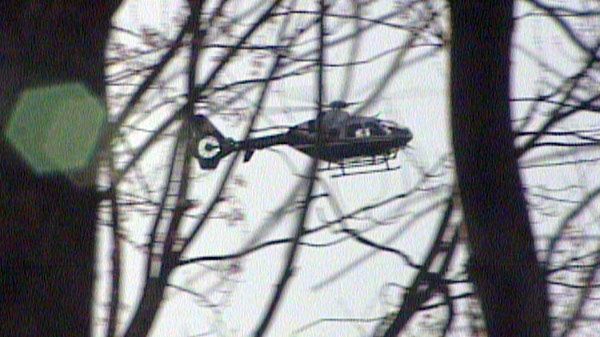An OPP helicopter takes part in a search of south end Guelph, Ont. on Thursday, April 12, 2012.
