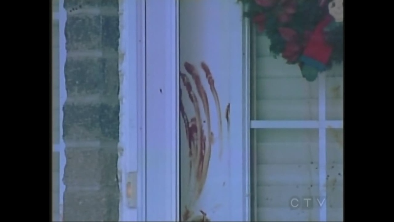 Blood is seen outside a neighbour's home near where a robbery was reported in London, Ont. on Wednesday, Dec. 10, 2014.